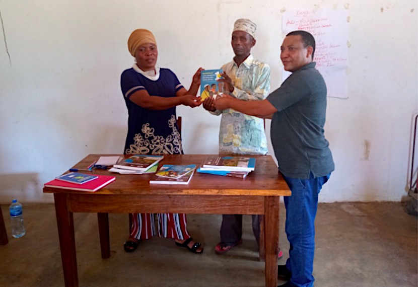 The guides being presented by Mr. Bernard Baha to the village leaders of Liwiti, Tanzania. Top Image