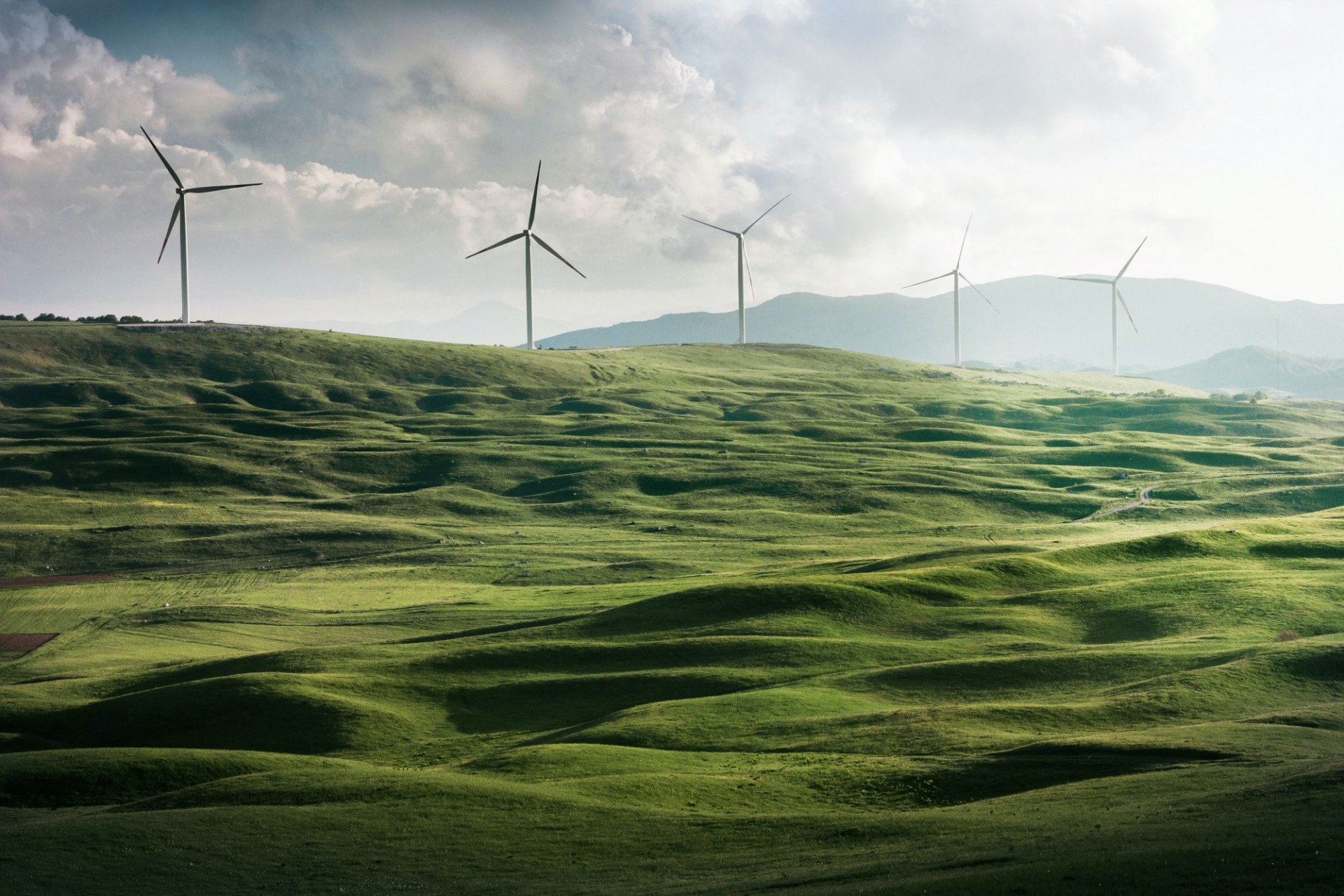 Bird's eye view of windmills in the countryside. 