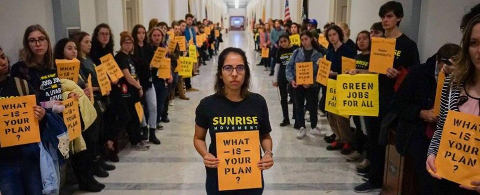 Image: Nelson Klein/Sunrise Movement holding sign